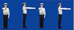圖中警察手勢為___信號。